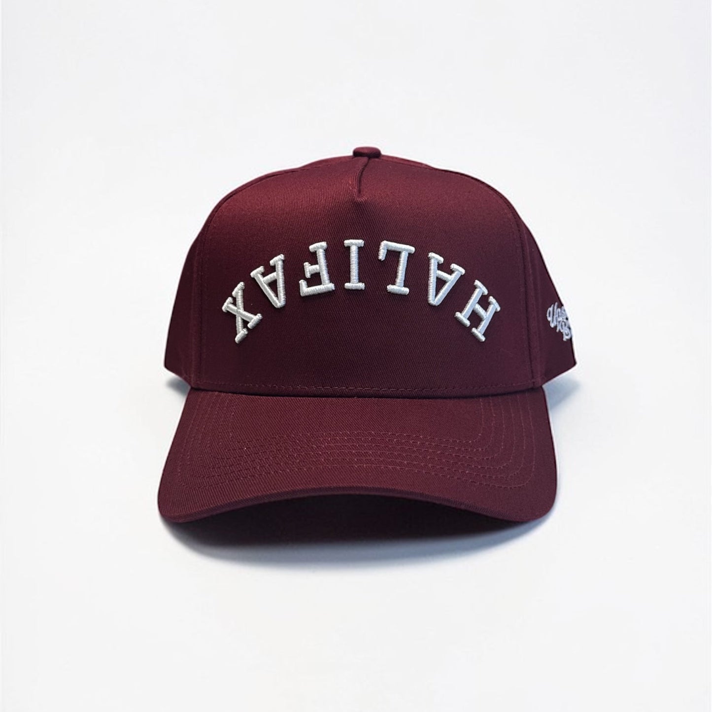 Maroon cap with 'HALIFAX' embroidered on a white background